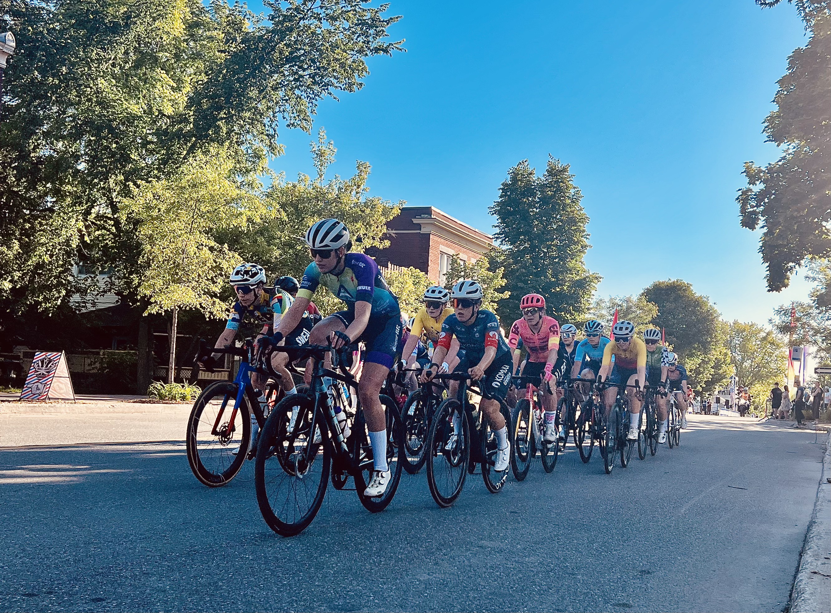 Criterium peloton racing through town